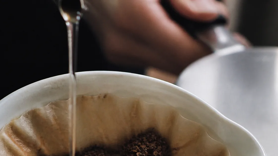 Water cuts through a lumpy coffee bed, leaving dry patches that explain an uneven cup.
