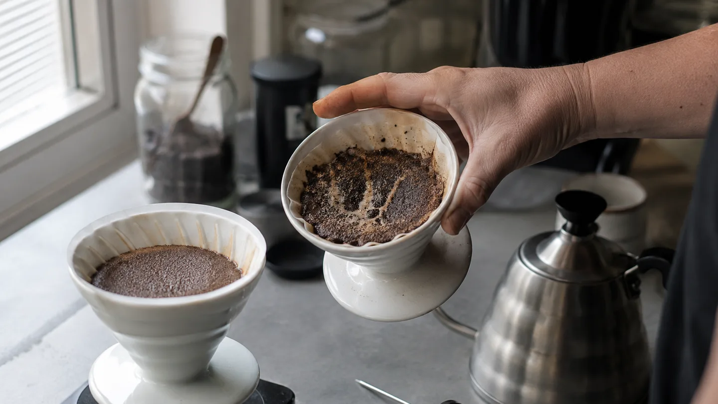 Two drippers show an even coffee bed and pale channels, helping diagnose uneven water flow.