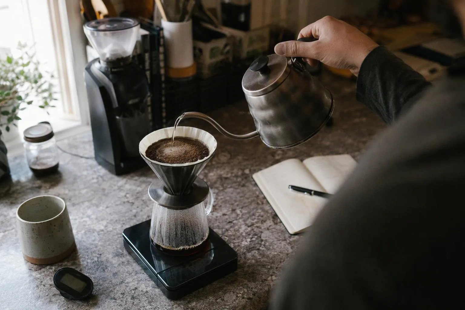 A measured pour-over sits on a scale beside a brew-time record during a fast-extraction diagnosis.
